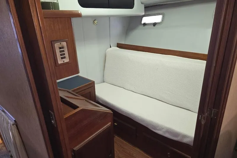 Slide: The Image of Interior of 1987 Bayliner 4550 Motoryacht with wooden cabinetry and cushioned seating. - 32