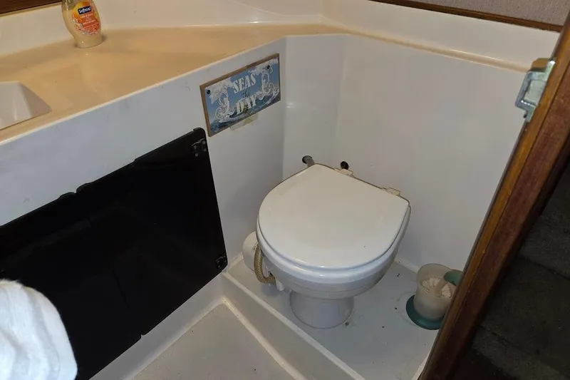 Slide: The Image of 1987 Bayliner 4550 Motoryacht bathroom with toilet and sink area. - 40