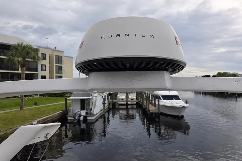 Slide: The Image of Bayliner 4550 Motoryacht 1987 with Quantum radar, docked near waterfront buildings. - 59