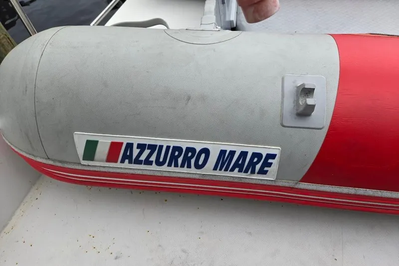 Slide: The Image of Red and gray inflatable boat with "Azzurro Mare" label, Bayliner 4550 Motoryacht, 1987. - 64
