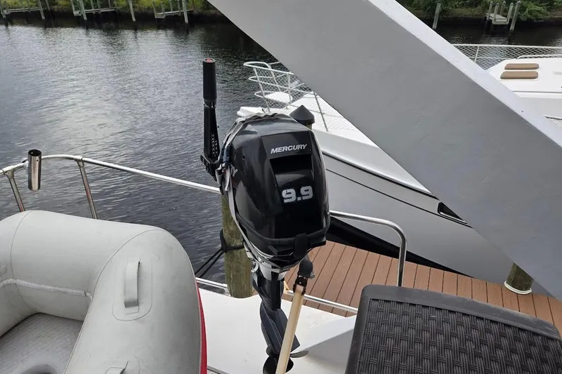 Slide: The Image of 1987 Bayliner 4550 Motoryacht with Mercury 9.9 outboard motor on deck. - 66