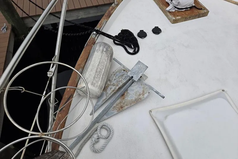 Slide: The Image of 1987 Bayliner 4550 Motoryacht deck with anchor, fender, and rope. - 69