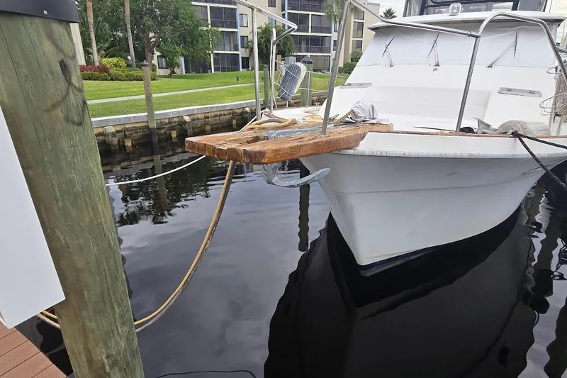 Slide: The Image of 1987 Bayliner 4550 Motoryacht docked near waterfront buildings. - 73