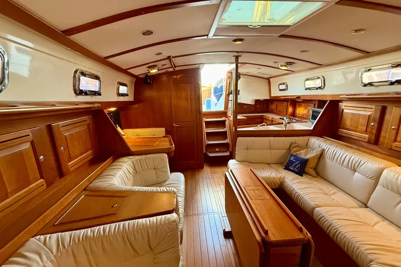 Slide: The Image of Luxurious interior of 2015 Tartan 4000 yacht with elegant wood finish and plush seating. - 15