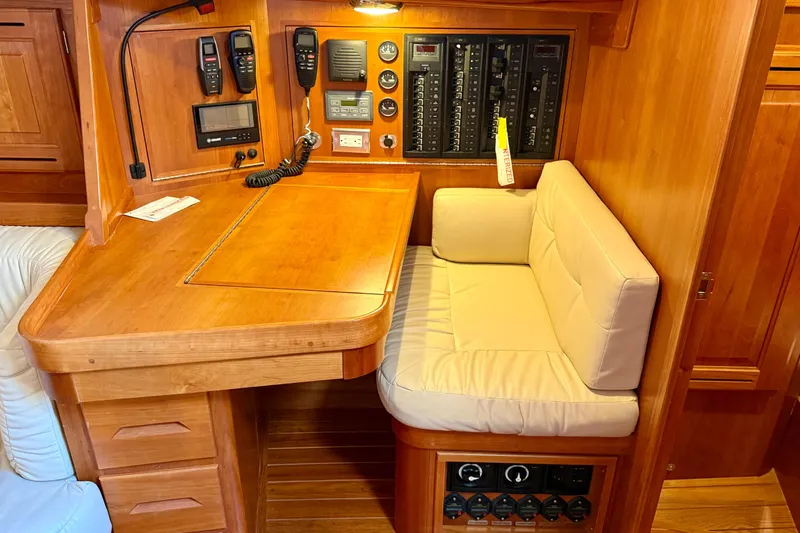 Slide: The Image of Cozy Tartan 4000 yacht navigation station with wood finish and communication equipment, 2015 model. - 19