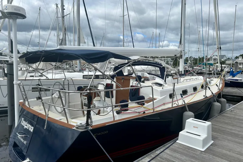 Slide: The Image of Sailboat Tartan 4000, 2015 model, docked at marina under cloudy skies. - 6