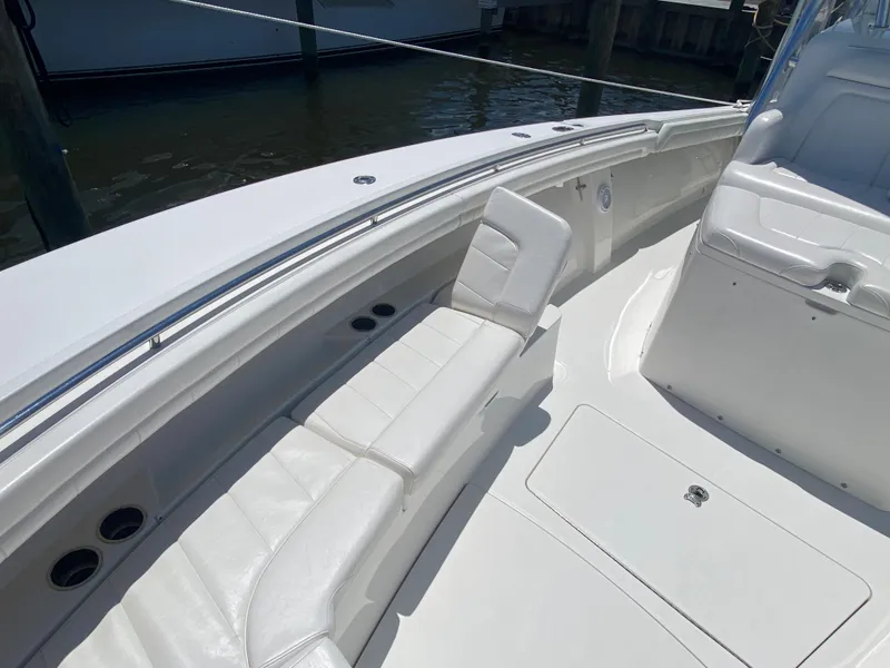Slide: The Image of 2016 Regulator 41 boat with white seating and sleek design. - 20