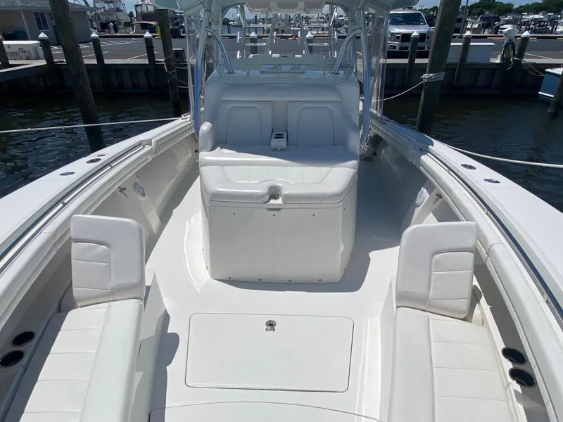 Slide: The Image of 2016 Regulator 41 boat interior with white seating and spacious deck. - 21