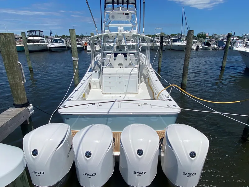 Slide: The Image of 2016 Regulator 41 boat with four 350 HP engines docked at marina. - 30