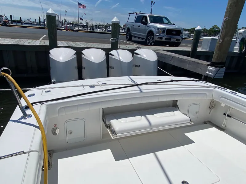 Slide: The Image of 2016 Regulator 41 boat docked with triple outboard engines, marina in background. - 33