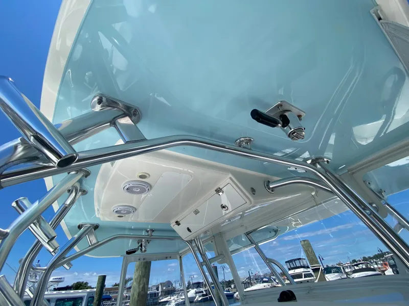 Slide: The Image of 2016 Regulator 41 boat with stainless steel fixtures and blue sky background. - 43