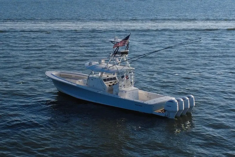 Slide: The Image of 2016 Regulator 41 boat on open water with multiple outboard engines. - 65