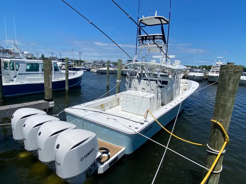 Slide: The Image of 2016 Regulator 41 boat docked with Yamaha outboard engines. - 9