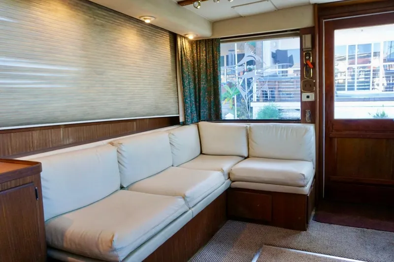 Slide: The Image of Interior of 1986 Hatteras 41 Convertible yacht with white leather seating. - 26