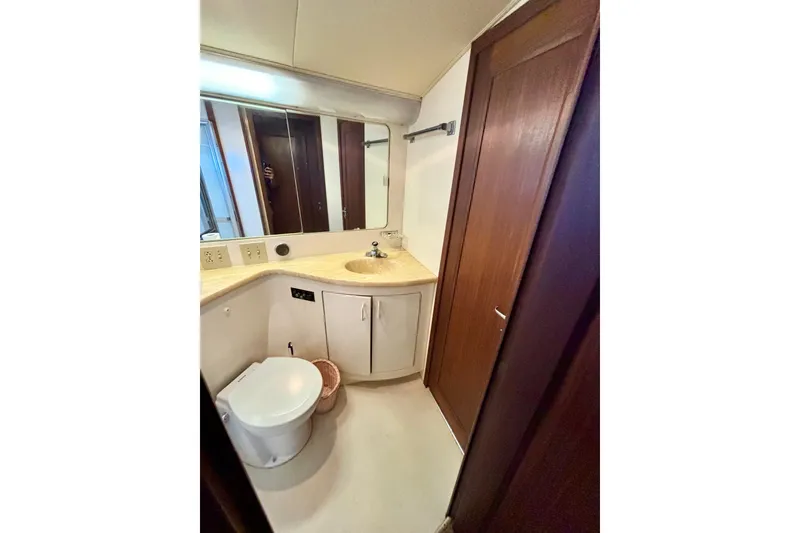 Slide: The Image of Bathroom interior of 1986 Hatteras 41 Convertible yacht, featuring sink and toilet. - 31