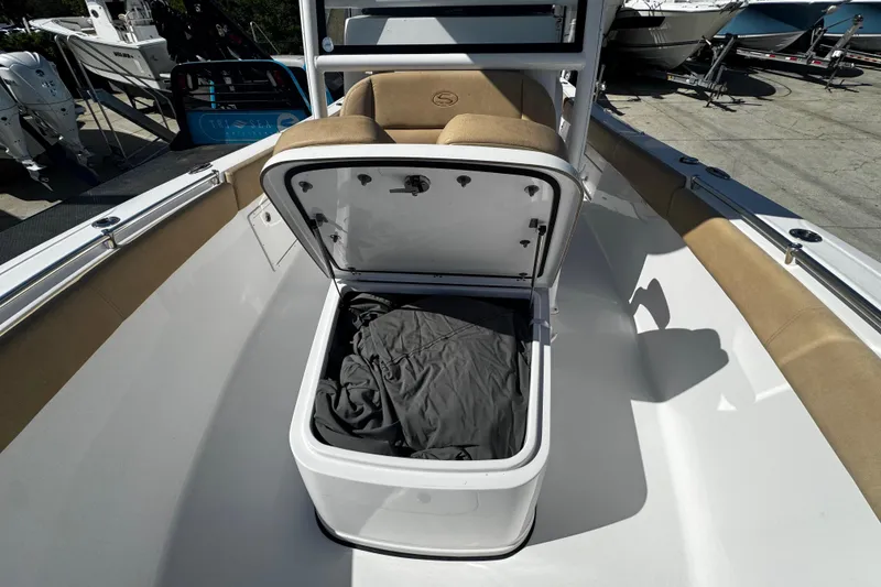 Slide: The Image of 2018 Sportsman Open 282TE Center Console boat with open storage compartment. - 10