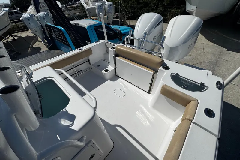 Slide: The Image of 2018 Sportsman Open 282TE Center Console boat interior with dual engines. - 5