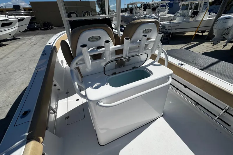 Slide: The Image of 2018 Sportsman Open 282TE Center Console boat interior with rod holders and seating. - 7