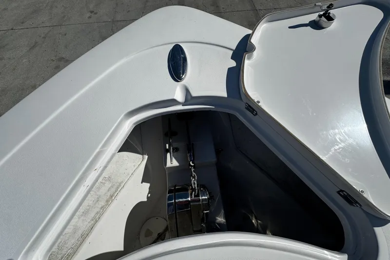Slide: The Image of 2018 Sportsman Open 282TE Center Console anchor compartment with open hatch. - 9