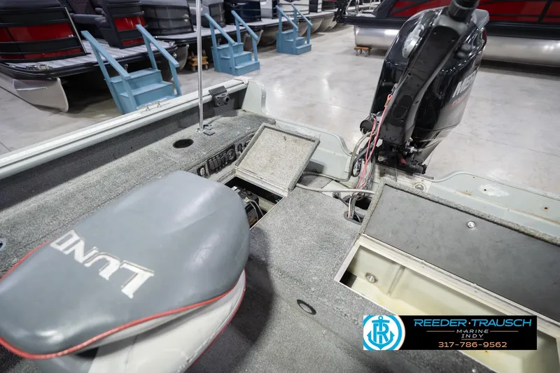 Slide: The Image of 2007 Lund 1600 Explorer SS boat interior with motor and storage compartments. - 23