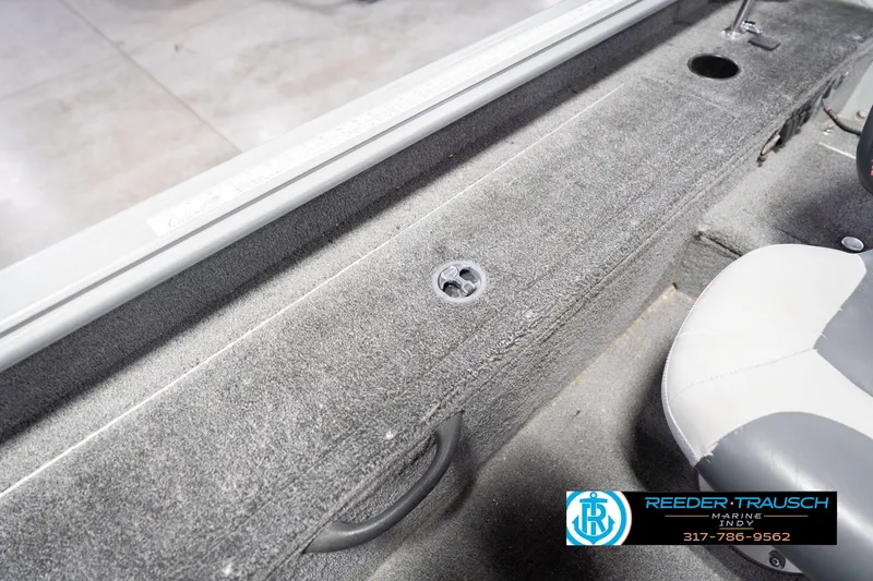 Slide: The Image of 2007 Lund 1600 Explorer SS boat interior with gray carpet and seating. - 24