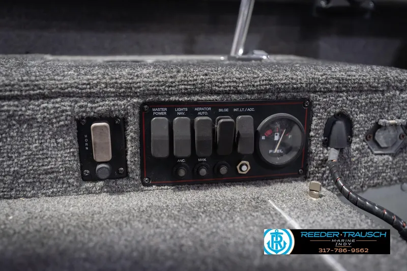 Slide: The Image of Control panel of a 2007 Lund 1600 Explorer SS boat with switches and fuel gauge. - 29