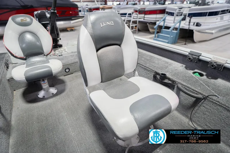 Slide: The Image of 2007 Lund 1600 Explorer SS boat interior with gray and white seating. - 33