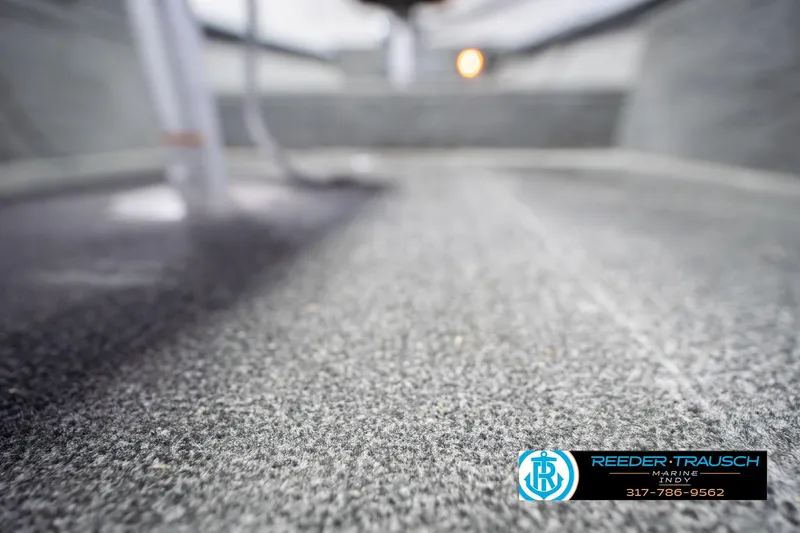 Slide: The Image of Carpeted interior of a 2007 Lund 1600 Explorer SS boat, close-up view. - 36