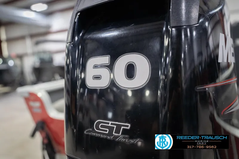 Slide: The Image of Outboard motor with "60" label on a 2007 Lund 1600 Explorer SS boat. - 39