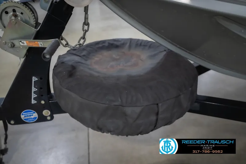 Slide: The Image of Trailer hitch with covered spare tire for 2007 Lund 1600 Explorer SS boat. - 48
