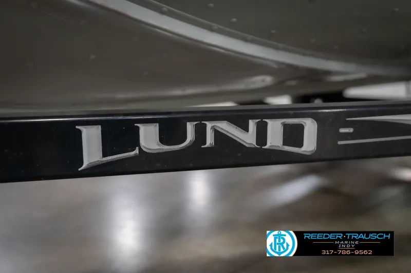 Slide: The Image of 2007 Lund 1600 Explorer SS boat trailer with logo, Reeder Trausch Marine contact info visible. - 50