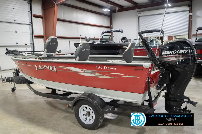 Slide: The Image of 2007 Lund 1600 Explorer SS boat with Mercury outboard motor in showroom. - 9