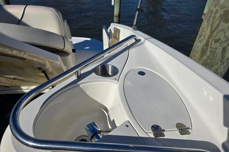 Slide: The Image of 2007 Monterey 250 Cruiser boat interior with sink and seating area. - 14