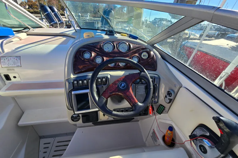 Slide: The Image of 2007 Monterey 250 Cruiser dashboard with steering wheel and control panel. - 17