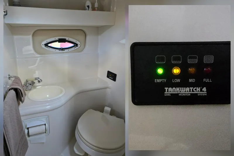Slide: The Image of 2007 Monterey 250 Cruiser bathroom with sink, toilet, and Tankwatch 4 level monitor system. - 29
