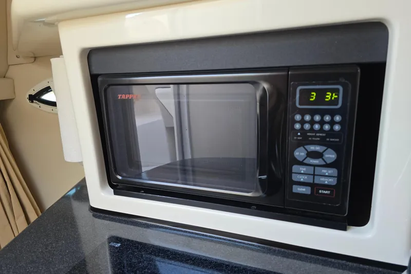 Slide: The Image of Microwave in 2007 Monterey 250 Cruiser boat interior kitchen area. - 33