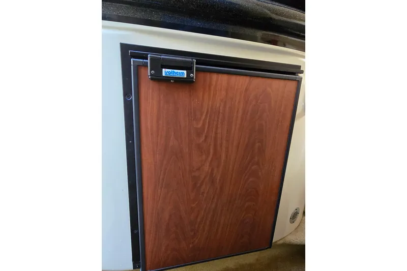 Slide: The Image of Wooden cabinet door on 2007 Monterey 250 Cruiser boat interior. - 34