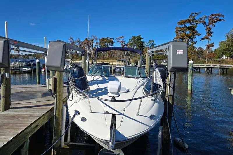 Slide: The Image of 2007 Monterey 250 Cruiser docked at marina under clear blue sky. - 4