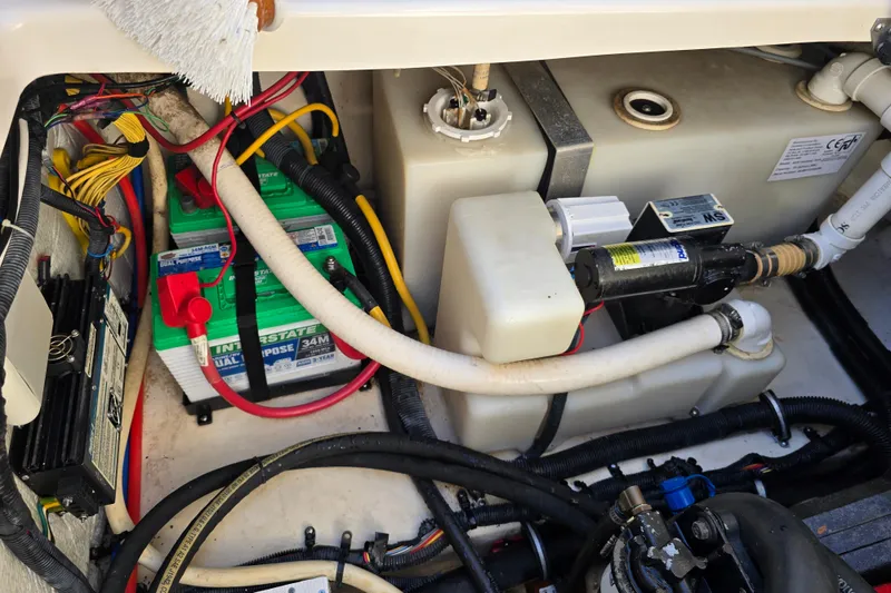 Slide: The Image of Engine compartment of a 2007 Monterey 250 Cruiser with battery and wiring. - 7