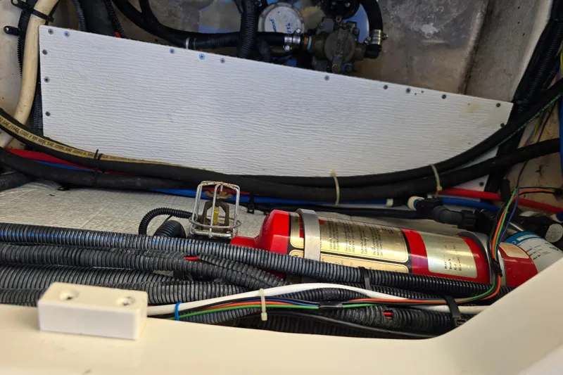 Slide: The Image of Engine compartment of a 2007 Monterey 250 Cruiser with fire extinguisher and wiring. - 8