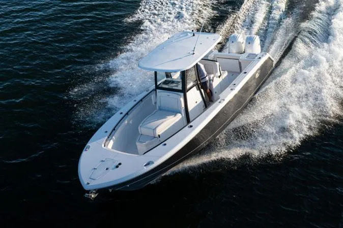 Slide: The Image of Manufacturer Provided Image: 2025 Sea Hunt Gamefish 27 Coffin Box cruising on water, showcasing sleek design and powerful performance. - 4