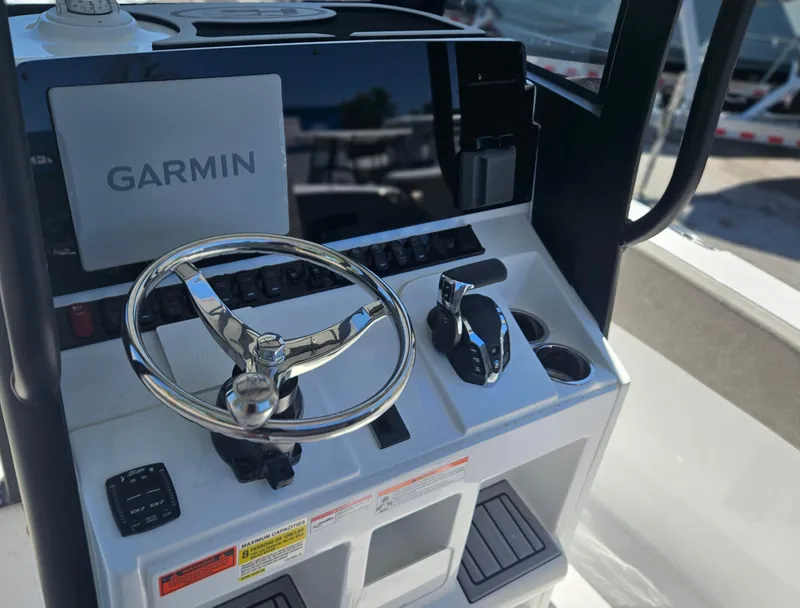 Slide: The Image of Control panel of 2025 Sea Hunt Ultra 245 SE boat with Garmin navigation system. - 10
