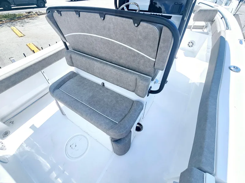 Slide: The Image of 2025 Sea Hunt Ultra 245 SE boat interior with cushioned seating and sleek design. - 13