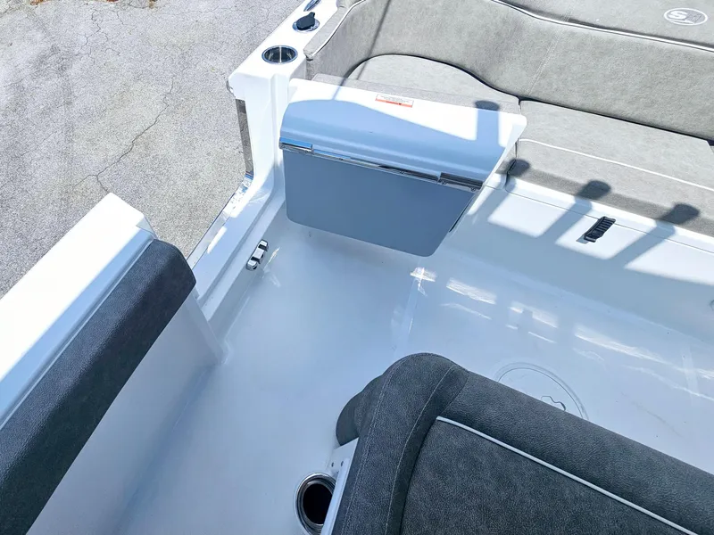 Slide: The Image of Interior view of 2025 Sea Hunt Ultra 245 SE boat, featuring seating and storage. - 19