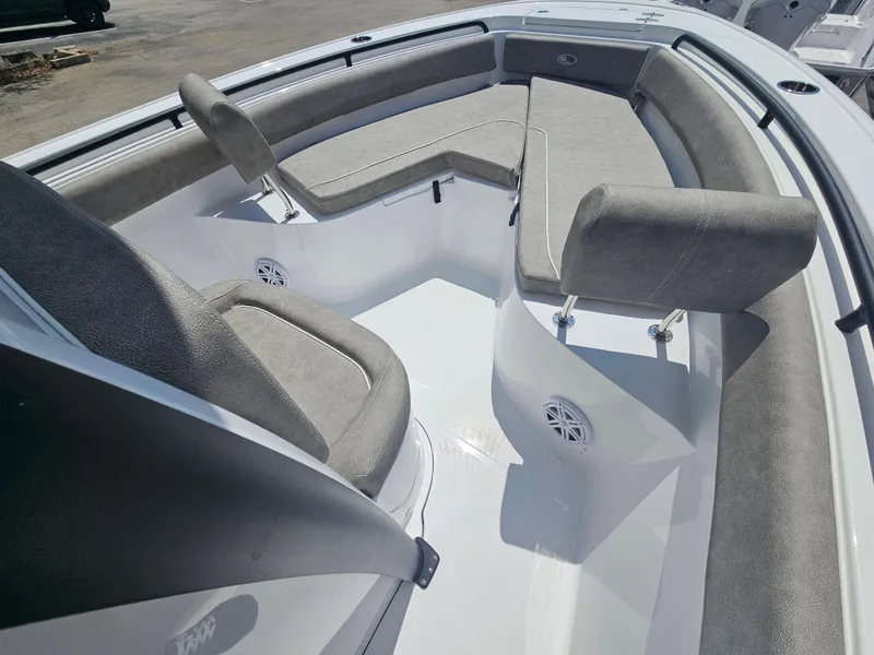 Slide: The Image of 2025 Sea Hunt Ultra 245 SE boat interior with cushioned seating and speakers. - 27