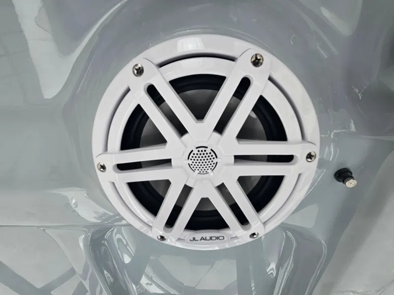Slide: The Image of White JL Audio speaker on 2025 Sea Hunt Ultra 245 SE boat. - 29