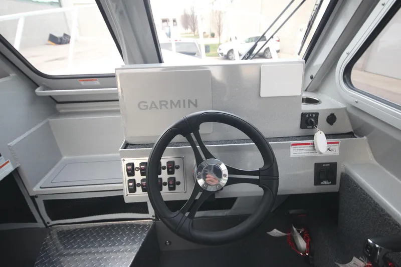 Slide: The Image of Interior of 2026 Weldcraft 240 Ocean King F300XCB boat, featuring modern helm and seating. - 19