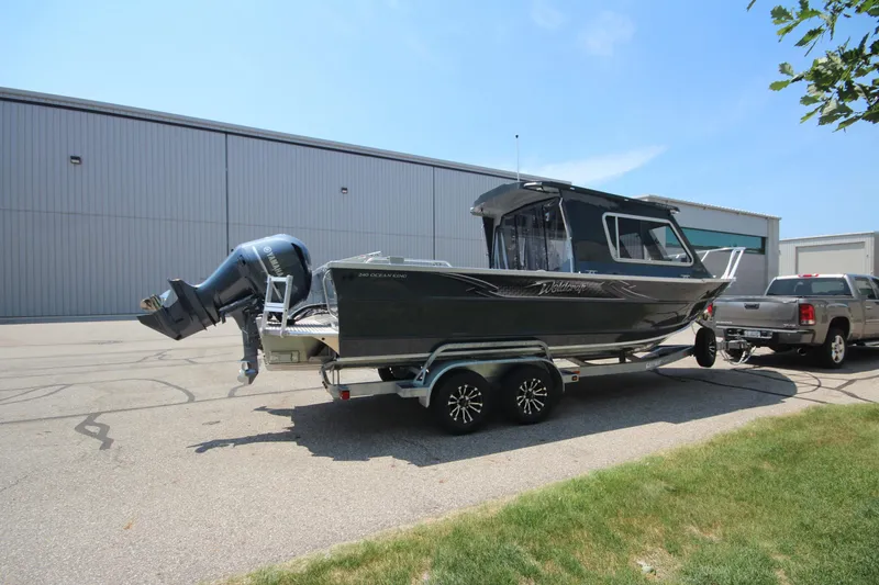 Slide: The Image of 2026 Weldcraft 240 Ocean King F300XCB boat in showroom, on trailer, ready for sale. - 2