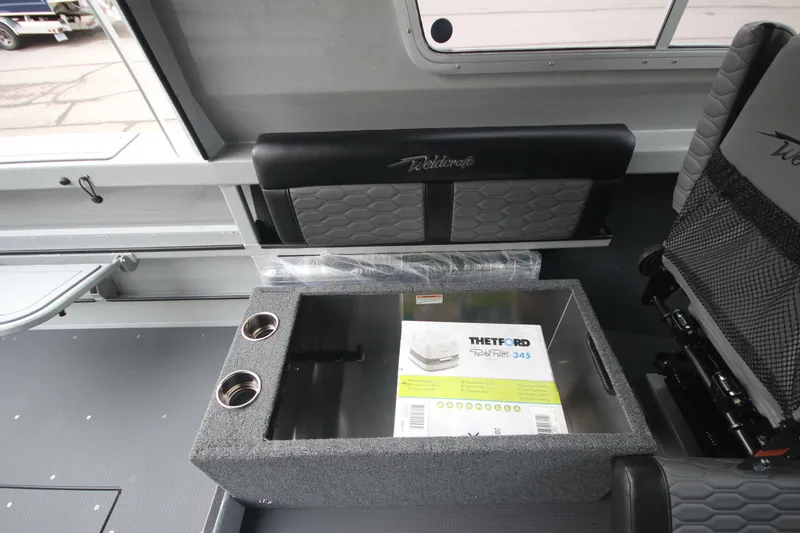 Slide: The Image of 2026 Weldcraft 240 Ocean King F300XCB interior with modern seating and steering console. - 23