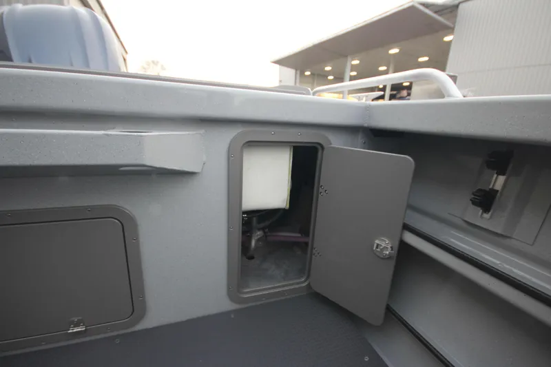 Slide: The Image of 2026 Weldcraft 240 Ocean King F300XCB boat with dual outboard motors in showroom. - 8